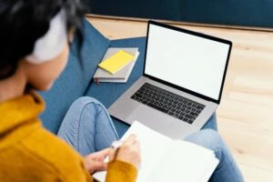 teenage_girl_with_headphones_laptop_during_online_school_300x200